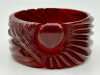 vintage wide cherry amber or wine translucent sunrise or comet carved bakelite bangle